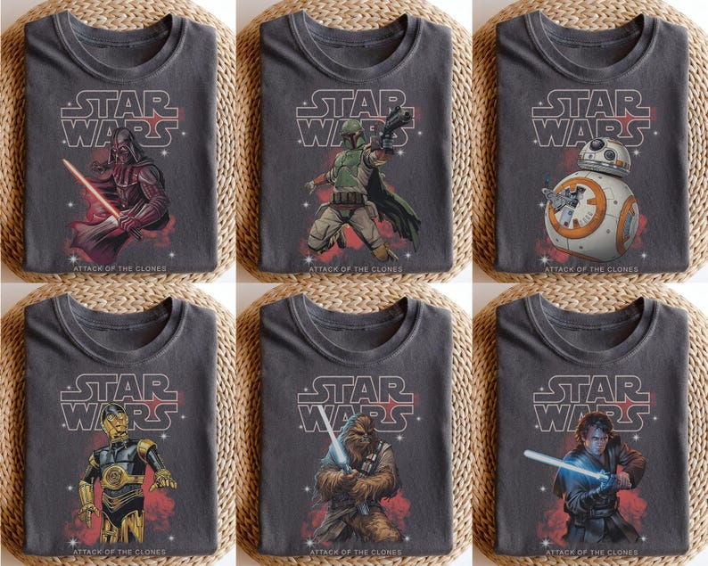 May include: Six gray t-shirts featuring Star Wars characters. Each shirt has the Star Wars logo and the text "Attack of the Clones." The characters include Darth Vader, Boba Fett, BB-8, C-3PO, Chewbacca, and Anakin Skywalker.