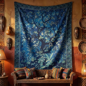 May include: A large blue tapestry with a tree design hangs on a wall. The tapestry features a detailed illustration of a tree with leaves and flowers. Decorative pillows and a wooden bench are in front of the tapestry. The wall is decorated with masks and baskets.