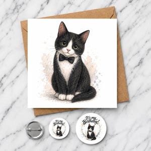 May include: A square greeting card featuring a black and white tuxedo cat wearing a black bow tie, accompanied by two circular pin-back buttons displaying the same cat illustration and the text It's my Birthday! on a white background.