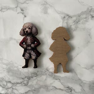 A poodle in clothes, wooden cutout for crafting and jewellery making.
