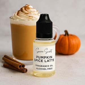 May include: A clear glass bottle of "Pumpkin Spice Latte" fragrance oil with a black cap, next to a pumpkin spice latte, a small orange pumpkin, and cinnamon sticks. The label reads "Serene Scents, Pumpkin Spice Latte, Fragrance Oil, Alcohol Free."