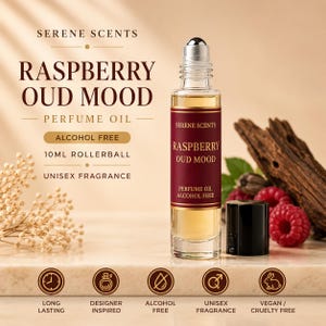 May include: A 10ml rollerball bottle of "Raspberry Oud Mood" perfume oil with a burgundy label. The bottle is clear glass and sits next to fresh raspberries and wood. The label states "Alcohol Free" and "Unisex Fragrance".