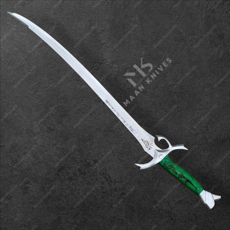May include: A curved sword with a silver blade and a green handle. The handle has an intricate design carved into it. The sword has a decorative hilt and a curved blade. The text "Maan Knives" is visible on the image.