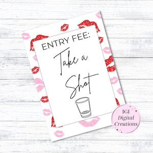 May include: A white rectangular sign with the text "ENTRY FEE: Take a Shot" in black script. The sign is decorated with red and pink lip prints. A small shot glass illustration is below the text.