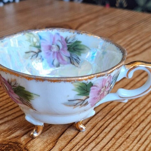 Vintage three-footed purple flowered demitasse teacup