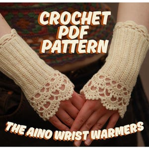 May include: Cream-colored crochet wrist warmers with a scalloped edge and a decorative lace pattern. The text on the image reads "CROCHET PDF PATTERN" and "THE AINO WRIST WARMERS".