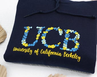 花柄の文字刺繍入りカレッジスウェットシャツ：大学の女子学生クラブへのパーソナライズギフト