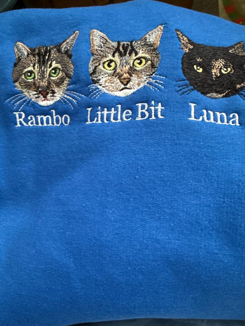 Real product photo of a custom embroidered item featuring personalized embroidery, detailed machine stitching, visible thread texture, and a beautifully finished design. The actual embroidered product showcases natural fabric texture, precise stitching, and high-quality craftsmanship, highlighting a unique personalized gift made with real embroidery.