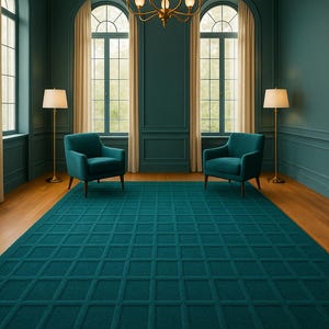 May include: A teal-colored rug with a geometric grid pattern dominates the room. Two teal armchairs face each other, and two floor lamps flank the chairs. The room has teal walls, arched windows, and a chandelier. The text "Rugged By Hand" is visible.