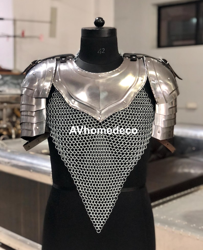 May include: A polished steel breastplate and shoulder armor set with chainmail. The armor is displayed on a black mannequin. The text "AVhomedeco" is visible at the bottom of the image. The armor is designed for historical reenactment or display.