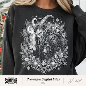Könnte beinhalten: Schwarzes Sweatshirt mit einer detaillierten Schwarz-Weiß-Illustration einer gehörnten Figur mit bedrohlichem Gesichtsausdruck, die ein Bündel Zweige und Glocken hält. Das Design umfasst einen Mond, Sterne und dekorative Elemente. Der Text "Premium Digital Files" steht unten.