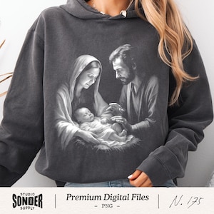 May include: Charcoal grey hoodie with a black and white image of the Holy Family. The graphic is vintage-style. The text "Premium Digital Files" and "Studio Sonder Supply" are also visible on the hoodie.