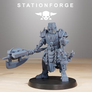 May include: A gray figurine of a warrior in detailed armor, holding a large axe. The figurine has a helmet and is adorned with chains and skulls. The text "STATIONFORGE" and a skull logo are visible at the top.