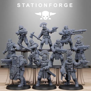 May include: A collection of gray miniature figurines of soldiers, each armed with weapons like guns, axes, and shields. The figurines are arranged on a tiered display, with the text "STATIONFORGE" and a skull logo at the top.