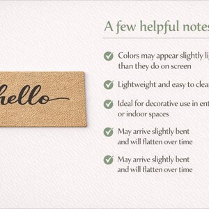 May include: A rectangular doormat with the word "hello" in a cursive font. The mat is a light brown color and is made of a textured material. The text is in black.