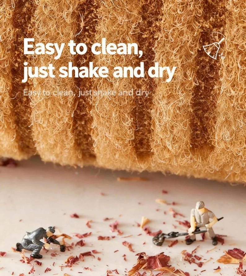 May include: Close-up of a textured, tan-colored cleaning sponge with the text "Easy to clean, just shake and dry." Miniature figures are depicted cleaning up debris. The sponge appears to be made of natural fibers.