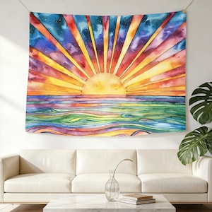 May include: A vibrant watercolor tapestry depicting a sunset over the ocean. The artwork features a bright yellow sun with radiating orange and red rays, above a colorful sea of green, blue, and purple waves. The tapestry is hung on a wall.