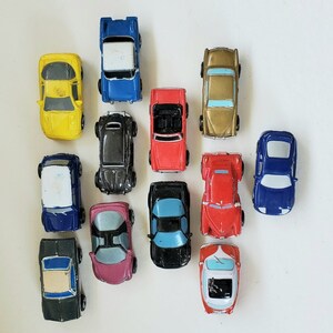 Vintage Lot of LGTI Galoob Micro Machine toy cars plus jiffy lube building from 1990s, miniature toy cars