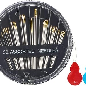 May include: A circular plastic case contains 30 assorted needles with gold-coloured eyes. The case is labelled "30 ASSORTED NEEDLES". Two needle threaders, one red and one blue, are also visible.