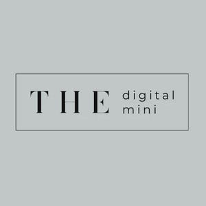 May include: A rectangular graphic on a grey background displays the word "THE" in a bold, serif font, followed by "digital mini" in a smaller, sans-serif font. The text is enclosed within a thin, black rectangular border.