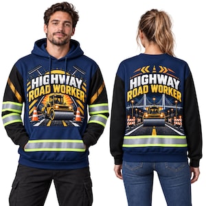 May include: A navy blue hoodie with black sleeves featuring a graphic of a yellow road roller, orange traffic cones, and the text HIGHWAY ROAD WORKER. The garment includes horizontal reflective silver and neon yellow stripes on the sleeves and torso.