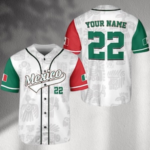 May include: White baseball jersey with green and red accents. The front features the word "Mexico" and the number "22". The sleeves are red with green cuffs. The back has the number "22" and the text "YOUR NAME". The jersey has a button-up front.