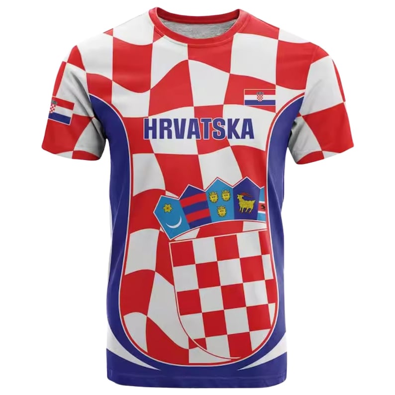 May include: A short-sleeved t-shirt with a Croatian flag design. The shirt features a red and white checkered pattern, the word "HRVATSKA" in blue, and Croatian coat of arms imagery. The sleeves and sides are blue.