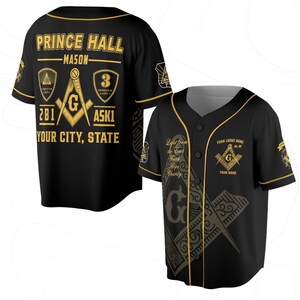 May include: Black baseball jersey with gold accents and text. The jersey features the words "PRINCE HALL" and "MASON" in gold, along with Masonic symbols and the text "YOUR CITY, STATE". The jersey has a button-up front and short sleeves.