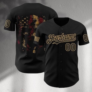 May include: Black baseball jersey with gold lettering reading "Yourteams" and the number "00". The jersey has a button-up front and a small American flag on the sleeve. The back features a distressed American flag design.