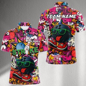 May include: A short-sleeved polo shirt with a vibrant, graffiti-style design. The shirt features a bowling ball character wearing sunglasses and riding a skateboard. The front of the shirt says "STRIKE" and "YOUR NAME". The back of the shirt says "TEAM NAME".
