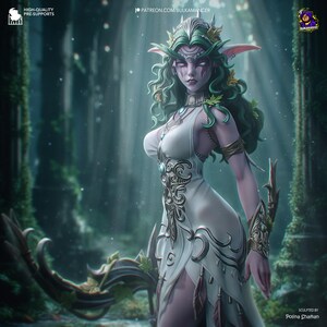 May include: A digital art image of a fantasy character, an elf-like woman, in a white dress with ornate gold and silver detailing. She has long, flowing green hair and wears a crown. The background is a blurred forest scene.