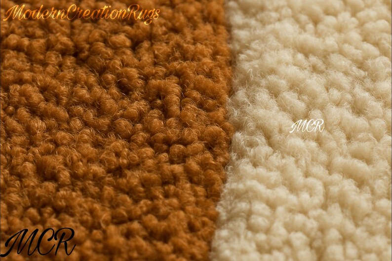May include: Close-up of a rug with a textured, looped pile. The rug is divided into two sections: one in a warm brown hue and the other in a creamy off-white. The letters "MCR" are visible in the lower corners. The words "Modern Creation Rugs" are at the top.