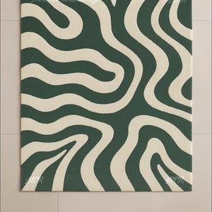 May include: A rectangular rug with a dark green background and a cream-colored, wavy pattern. The rug has the text "Modern Creation Rugs" and "MCR" in the corners. The rug is on a light beige tiled floor.