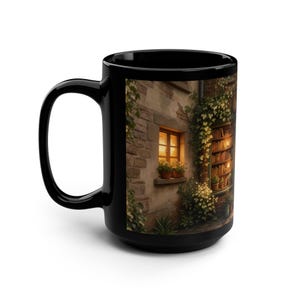 May include: Black ceramic mug with a detailed illustration of a cosy outdoor scene. The image shows a stone building with a window, potted plants, and a bookshelf, all lit by warm light. The mug has a large handle.