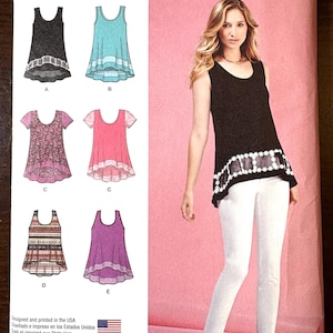May include: Simplicity sewing pattern 1113 features various top designs. The pattern includes options for sleeveless, short-sleeved, and layered tops. The image shows a woman wearing a black top with white pants. The pattern is designed and printed in the USA.
