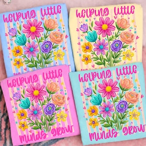 May include: Four colorful floral-themed square designs. Each features a bouquet of flowers in various colors, including pink, yellow, orange, purple, and teal. The text "helping little minds grow" is displayed in pink on each design.