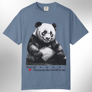 A garment-dyed t-shirt featuring a beloved panda. It offers a comfortable, relaxed fit and is finished with double stitching for durability and longevity. Available in 8 colors and sizes S-4XL.