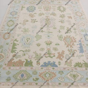 Hand Knotted Wool Oushak Rug: Cream & Blue Turkish Inspired Design