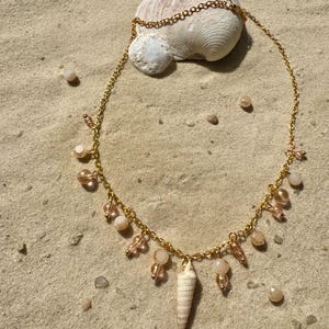 Handmade charm necklace made from natural seashells