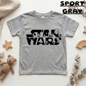 May include: A handmade wooden sign with the text "Welcome" in a handwritten style. The sign is painted white with a distressed finish, and a small green leaf is attached to the top. The sign is designed for indoor or outdoor use.