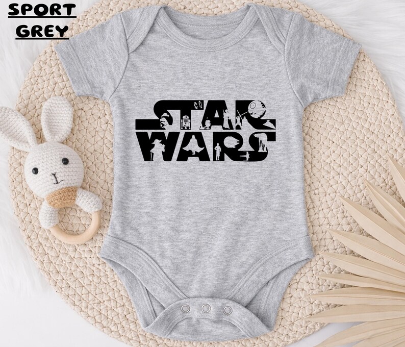 May include: A white ceramic mug with a black handle and the text "But First, Coffee" in a bold, black font. The mug is set against a blurred background, suggesting a cozy setting.