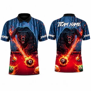 May include: A short-sleeve polo shirt featuring a black bear graphic playing billiards on a red table with flaming balls and a cue stick. The design includes a dark forest background, the text "TEAM NAME" on the back, and "NAME" on the sleeves.