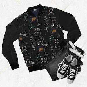 May include: Black bomber jacket with a repeating pattern of graphics and text, including the words "I'M SORRY" and "LOST". The jacket is paired with dark wash jeans, a white belt, and black and white sneakers.