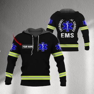 May include: Black hoodie with a gray hood and drawstrings. The hoodie features a blue Star of Life emblem and the text "YOUR NAME". The sleeves have yellow and green stripes, and the back displays "EMERGENCY MEDICAL SERVICES EMS".