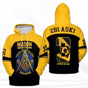 May include: A yellow and black hoodie with Masonic symbols and text. The front features a Masonic emblem with the words "MASON" and "YOUR LODGE NAME". The back displays "2B1 ASKI" and "3 DEGREE OF LIGHT".