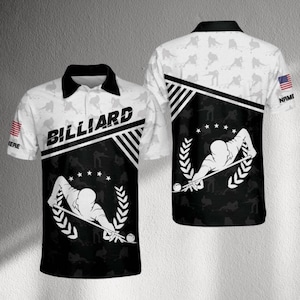 May include: White and black polo shirt with a billiard theme. The shirt features the word "BILLIARD" in bold letters, a graphic of a person playing pool, and the American flag on the sleeve. The shirt has a black collar.