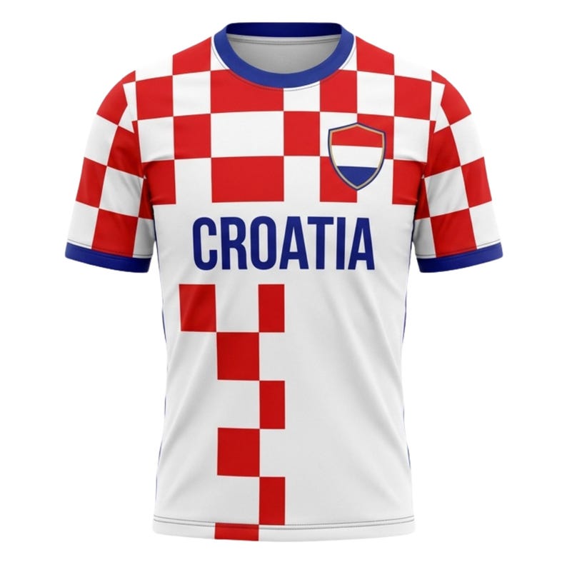 May include: White and red checkered Croatia soccer jersey with blue accents. The jersey features the word "CROATIA" in navy blue across the chest, along with a shield emblem. The sleeves and collar are trimmed in blue.