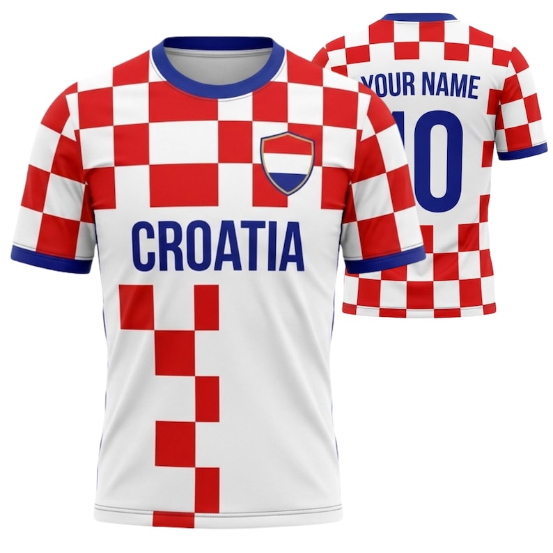 May include: White and red checkered Croatia soccer jersey with blue accents. The front features the word "CROATIA" in blue, a shield emblem, and a red and white checkered pattern. The back displays "YOUR NAME" and the number "0".