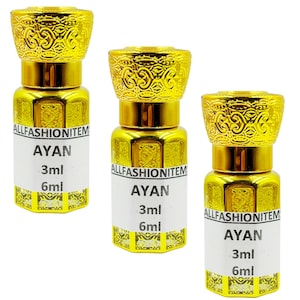 May include: Three gold-colored perfume bottles with ornate, textured caps. Each bottle has a white label with the text "AYAN", "3ml", and "6ml". The bottles are labeled "ALLFASHIONITEM".