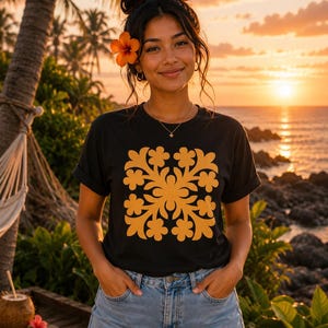 May include: A black short-sleeved t-shirt featuring a large, symmetrical, golden-yellow floral pattern printed on the center of the chest. The shirt has a crew neckline and rolled sleeves, paired with light blue denim shorts with a frayed hem.